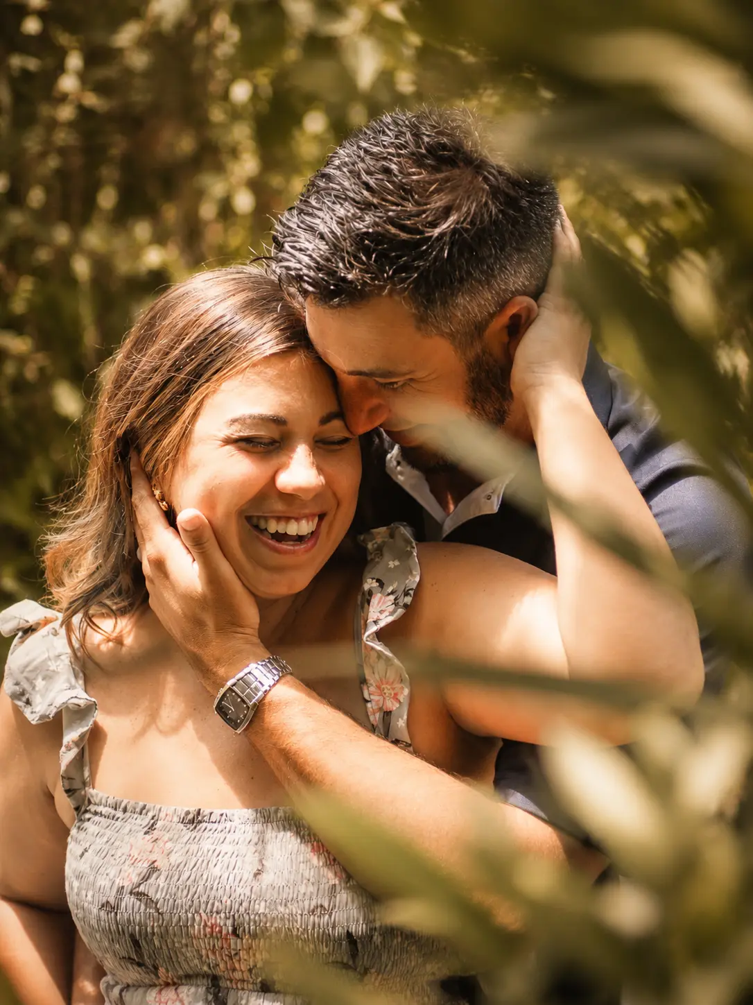 Artie maternity — joyful couple portrait among greenery
