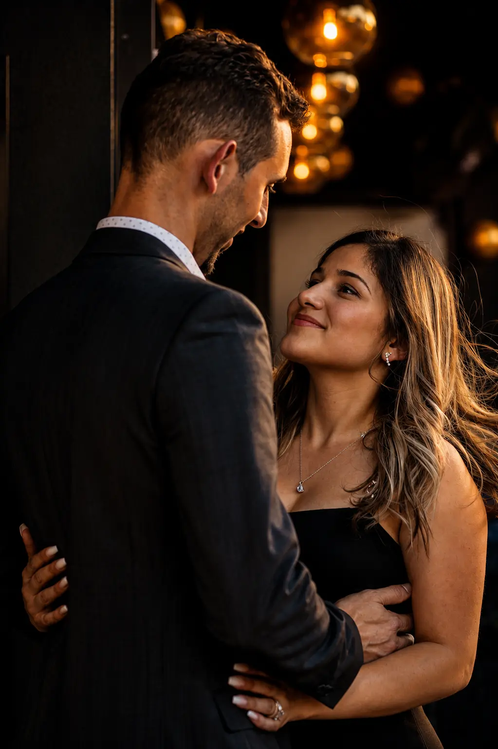 Zabelis — elegant couple portrait with warm bokeh lights